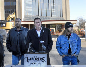 Matt Bartolo of Local 165 explains why the union worked on behalf of Warren Little, left, and Juan Goode in a dispute over payment for work for NMR Renovations of California at job site at former Sheraton Four Points hotel in Peoria.