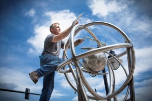 Fisher Stolz, local sculptor and professor at Bradley University, was one of 15 artists selected to have work included in Sculpture Walk Peoria, a project that enhances the Warehouse District streets and the vibrancy of the community. Photo © Dennis Slape