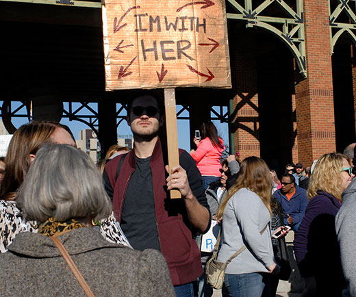 A man holds a sign at the Peoria women’s march Jan. 21, one of dozens of men showing solidarity for the causes.